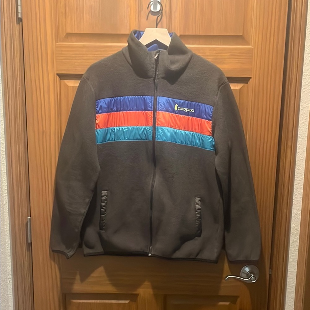 Cotopaxi Brown Jacket with Blue and Red Stripes